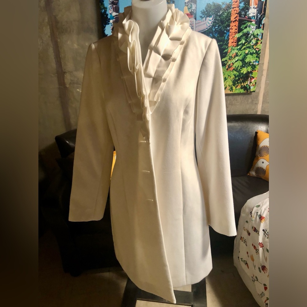 Ricki’s dress coat. Cream with ruffle detail. Size M. Excellent condition.